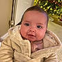 Rennie-Leigh is registered to the contest to win money with this photo: baby, child, christmas_tree, coat, cozy, cute, decorations, face, floor, happy, holiday, indoors, infant, lighting, portrait, radiator, robe, smile, soft_texture, warm