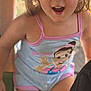 Maddie joined the competition — help win amazing prizes! child, toddler, smiling, romper, cartoon_character, pink_trim, shorts, cute, happy, outdoor, daylight, playground, person, face, skin, hair, earrings, expression, fun, youth