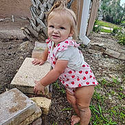 Hartley joined the competition — help win amazing prizes! barefoot, block, child, cute, dirt, expression, fence, garden, grass, nature, outdoor, pink_clothing, playful, standing, stone, strawberry_pattern, summer, toddler, tree, young_child