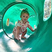 Hartley joined the competition — help win amazing prizes! toddler, child, playground, slide, tunnel, green, outdoor, sunlight, curious, baby, clothing, person, hand, nature, trees, playing, cute, crawling, adventure, daylight