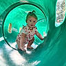 toddler, child, playground, slide, tunnel, green, outdoor, sunlight, curious, baby, clothing, person, hand, nature, trees, playing, cute, crawling, adventure, daylight