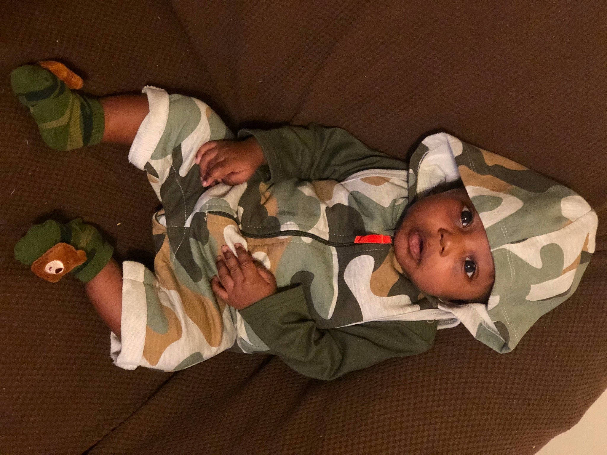 Jasir is registered to the contest to win money with this photo: baby, baby_products, baby_toddler_clothing, child, comfort, finger, fun, hat, headwear, joint, lap, linens, mammal, person, room, sitting, sock, thigh, toddler, vertebrate