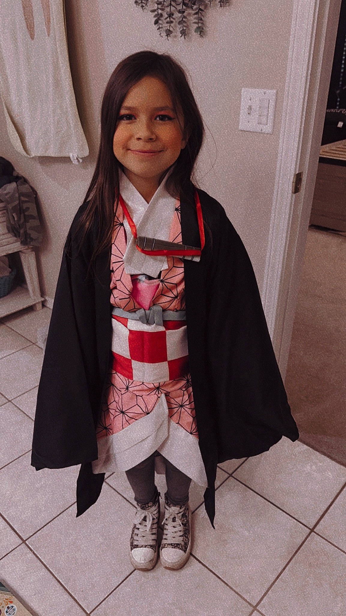 Haddie joined the competition — help win amazing prizes! costume, dress, event, fashion_accessory, fashion_design, flooring, formal_wear, human_leg, joy, knee, leg, pattern, person, sandal, scarf, school_uniform, shawl, sleeve, smile, thigh