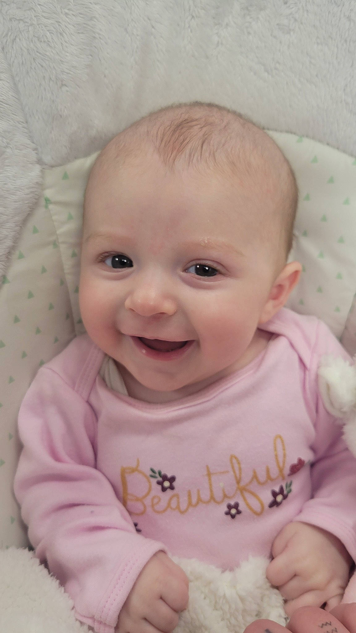 Elliana is registered to the contest to win money with this photo: baby, baby_toddler_clothing, cheek, child, chin, comfort, eye, eyebrow, happy, iris, joy, lip, mouth, nose, person, pink, product, skin, sleeve, smile