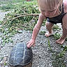 Rhiggs is registered to the contest to win money with this photo: child, toddler, turtle, outdoor, grass, gravel, barefoot, nature, animal, greenery, daylight, curious, branches, play, person, summer, skin, head, hand, crouching