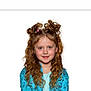 blue_shirt, casual_clothing, child, childhood, curly_hair, cute, face, fashion, girl, happy, headshot, innocence, long_hair, person, playful_hairstyle, portrait, smile, studio, white_background, youth