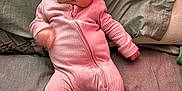 Ayla-May joined the competition — help win amazing prizes! baby, infant, pink_onesie, socks, bed, blanket, quilt, face, person, lying_down, cute, apparel, child, indoor, soft_lighting, motion_blur, portrait, newborn, sleepwear, cozy