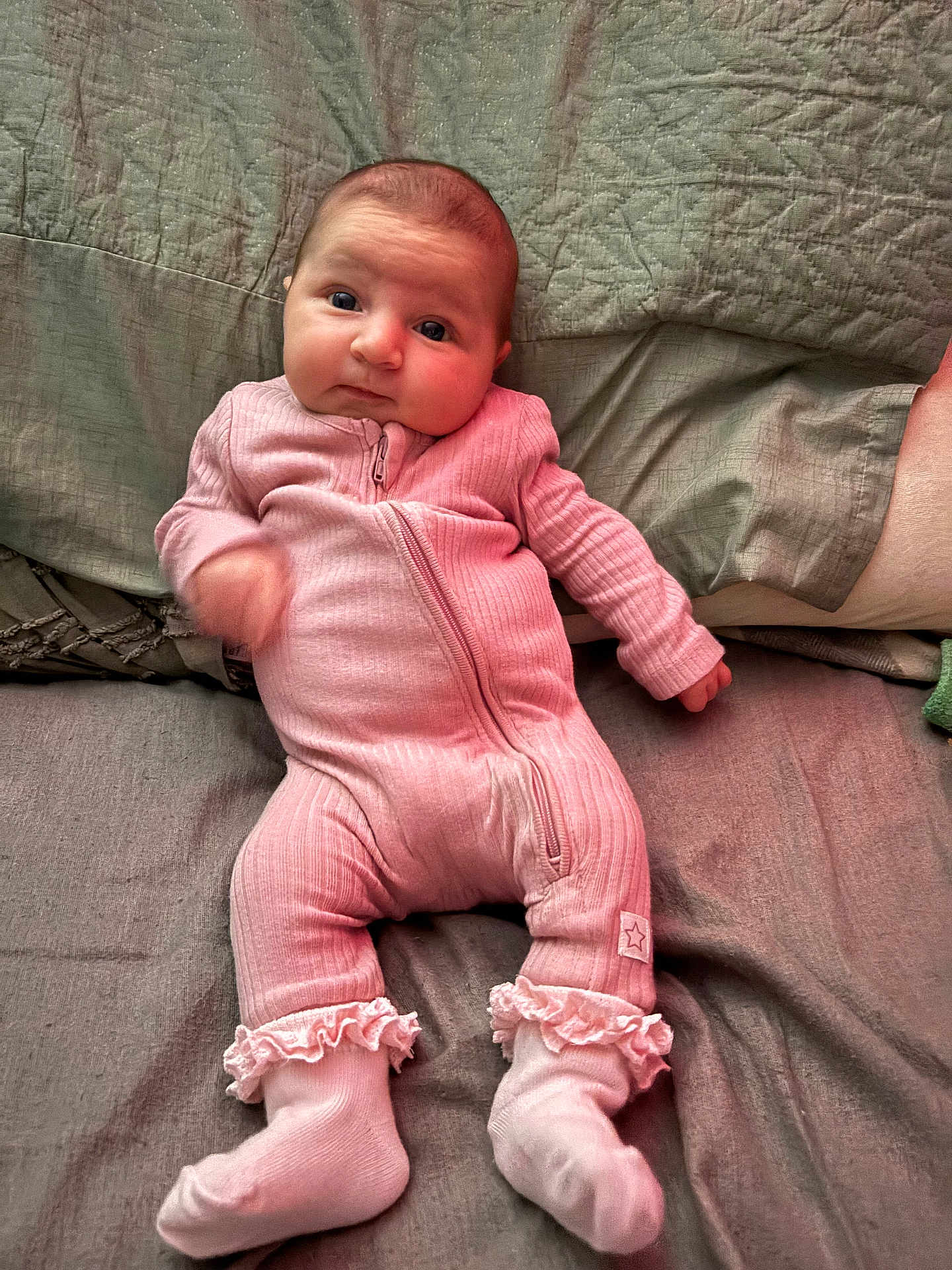 Ayla-May joined the competition — help win amazing prizes! baby, infant, pink_onesie, socks, bed, blanket, quilt, face, person, lying_down, cute, apparel, child, indoor, soft_lighting, motion_blur, portrait, newborn, sleepwear, cozy
