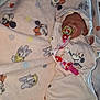 baby, newborn, pacifier, blanket, sleeping, onesie, headwear, cute, infant, child, cartoon_character, disney, minnie_mouse, ariel, soft_texture, bed, comfort, pink, adorable, resting