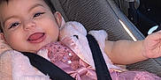Ashley joined the competition — help win amazing prizes! baby, child, car_seat, seatbelt, pink_dress, sparkly, jacket, smiling, happy, cute, infant, face, portrait, sitting, clothing, car_interior, safety, toddler, joy, fun
