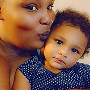 Eddonia Smith joined the competition — help win amazing prizes! woman, toddler, child, portrait, closeup, indoor, skin, face, headband, bracelet, polka_dot, clothing, affection, family, love, cute, smile, person, warmth, bond