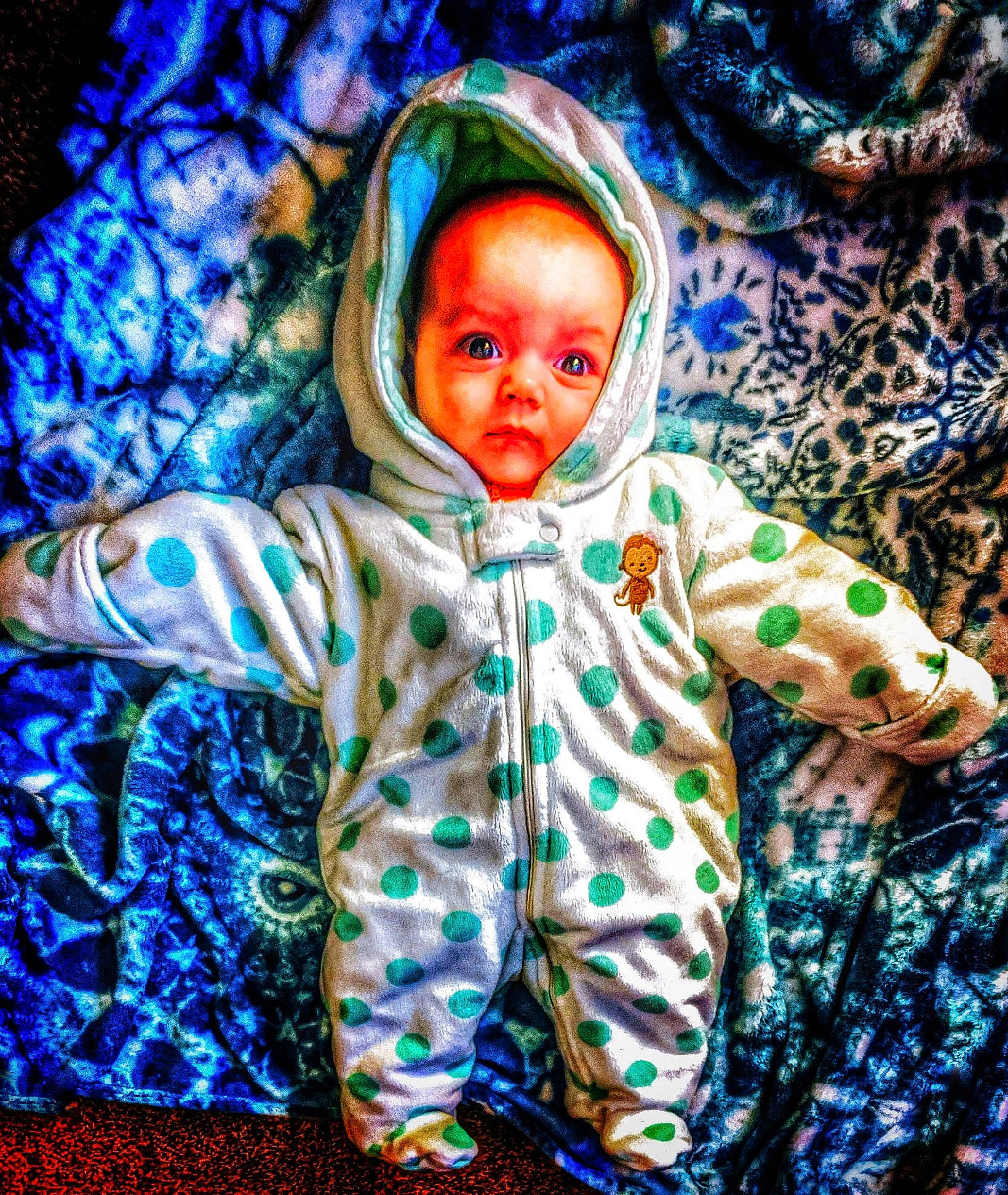 Chelsea is registered to the contest to win money with this photo: baby, blue, child, green, outerwear, person, sleeve, smile, space, toddler