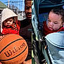 Kalil joined the competition — help win amazing prizes! toddler, child, basketball, stroller, blanket, outdoor, adult, court, sunny, clothing, toy, person, daytime, recreation, sports, family, baby, hood, wheel, park