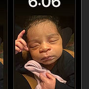 Legacy joined the competition — help win amazing prizes! baby, blanket, child, closeup, cozy, cute, dark_background, digital_clock, face, hand, infant, newborn, peaceful, person, portrait, resting, skin, sleeping, smartphone_screen, time_display