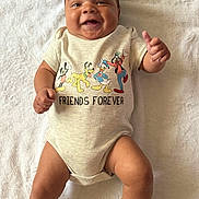 Mi'Zeir joined the competition — help win amazing prizes! baby, infant, smiling, onesie, disney_characters, mickey_mouse, donald_duck, pluto, goofy, shoes, cute, happy, lying_down, blanket, child, toddler, clothing, footwear, portrait, indoors