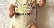 Mi'Zeir joined the competition — help win amazing prizes! baby, blanket, child, clothing, cute, disney_characters, donald_duck, footwear, goofy, happy, indoors, infant, lying_down, mickey_mouse, onesie, pluto, portrait, shoes, smiling, toddler