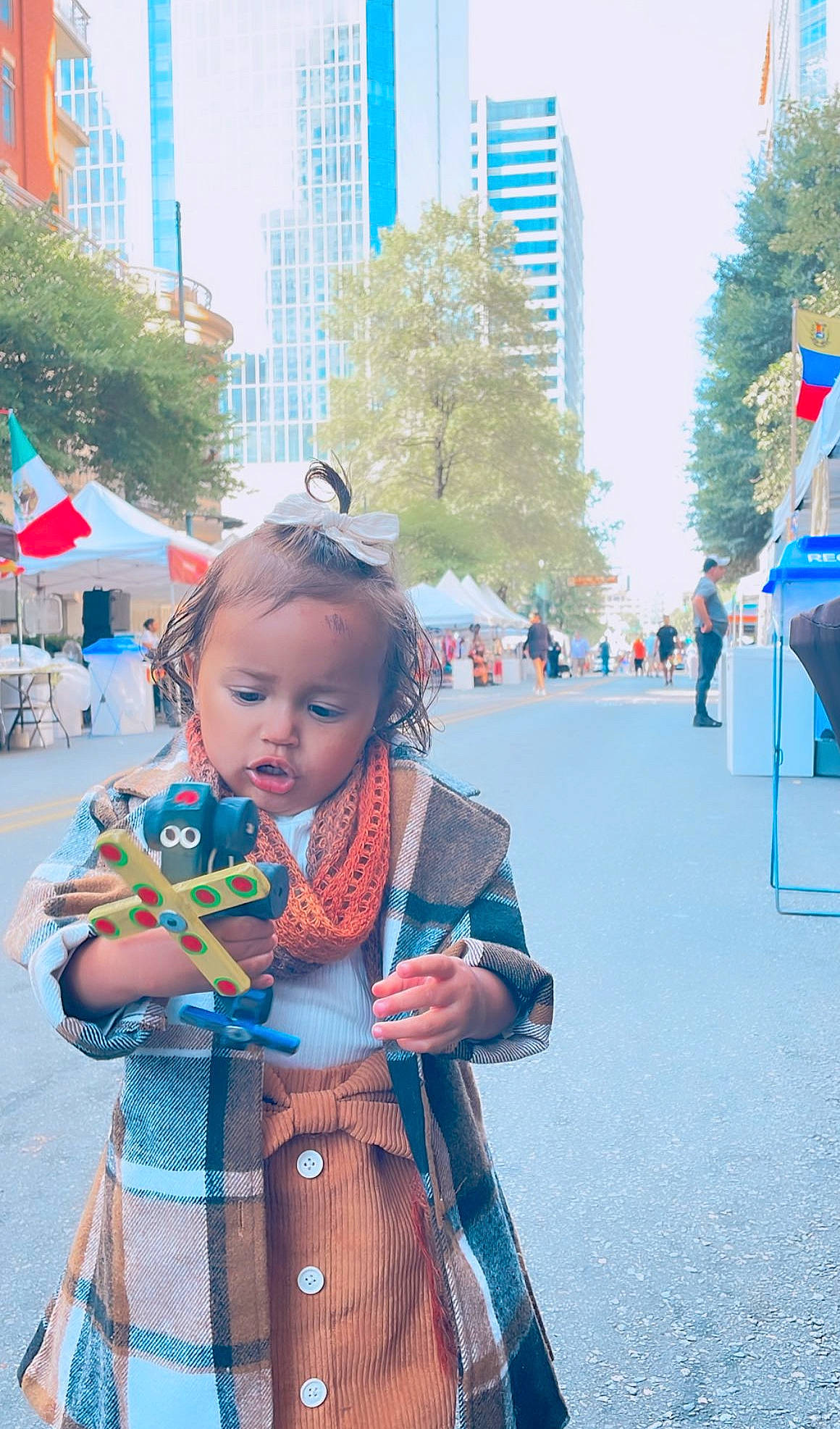 Haylee joined the competition — help win amazing prizes! blue, city, electric_blue, event, fun, leisure, pedestrian, people, person, photograph, pink, recreation, road, sky, skyscraper, snapshot, summer, toddler, tower_block, travel