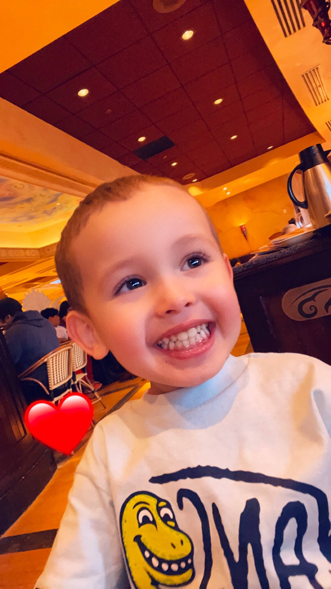 Mason is registered to the contest to win money with this photo: baby, cheek, child, chin, flooring, fun, hairstyle, happy, joy, laugh, leisure, logo, mouth, nose, person, room, sleeve, smile, t_shirt, toddler