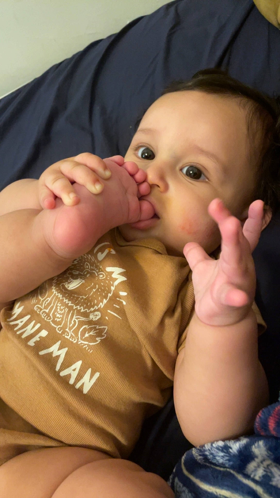 Jacob is registered to the contest to win money with this photo: arm, baby_toddler_clothing, cheek, chin, eyelash, finger, gesture, hand, human_body, iris, lip, mouth, muscle, nail, neck, nose, person, product, skin, sleeve