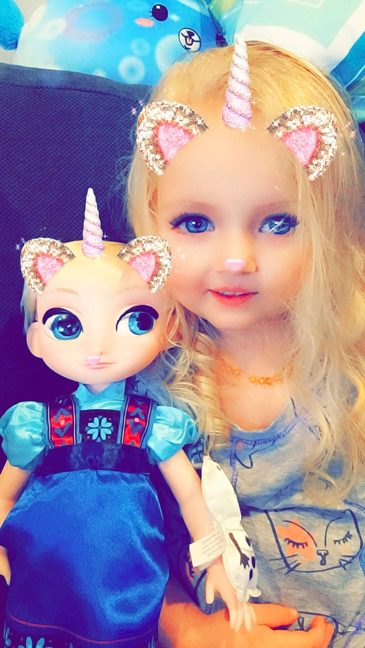 Autumn is registered to the contest to win money with this photo: barbie, blond, blue, child, doll, ear, eyelash, fawn, hair, hair_accessory, head, iris, lip, long_hair, person, pink, toy, wig