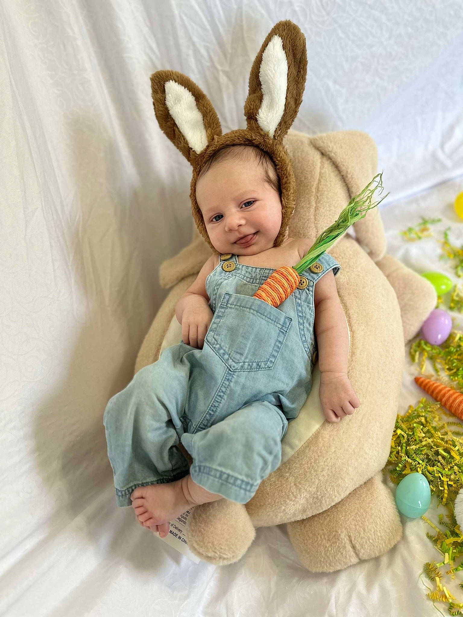Anakin is registered to the contest to win money with this photo: baby, baby_toddler_clothing, child, costume_hat, event, fashion_accessory, fawn, fur, happy, head, headband, headpiece, jewellery, mythical_creature, necklace, person, sitting, skin, sleeve, smile