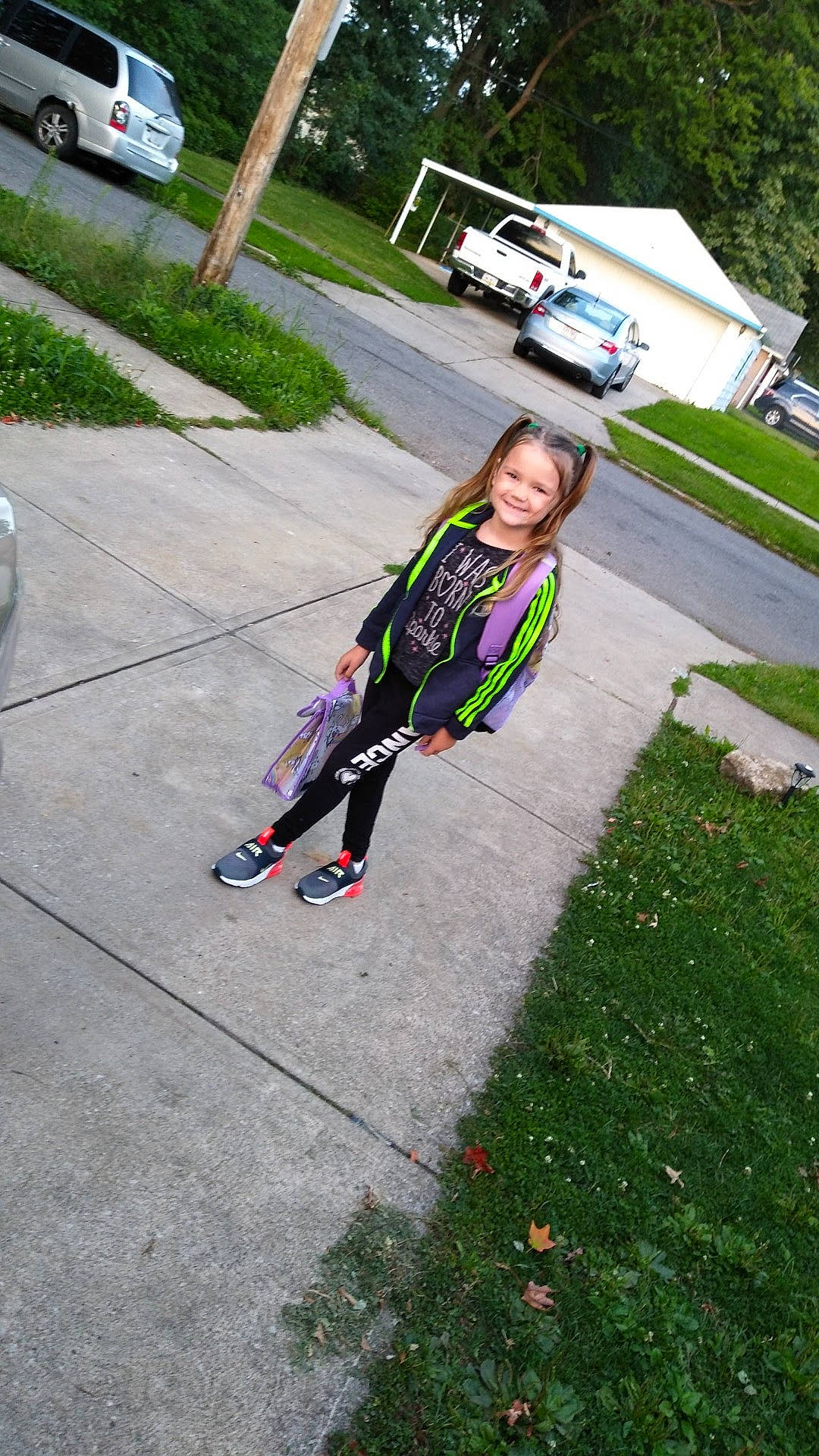 Julianna is registered to the contest to win money with this photo: asphalt, car, city, fun, grass, joy, lane, lawn, leisure, pedestrian, person, plant, recreation, road, road_surface, sidewalk, street, toddler, tree, truck