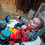 Braxton joined the competition — help win amazing prizes! baby, child, smiling, indoor, walker, toy, book, pointing, happy, person, clothing, floor, kitchen, cabinet, stool, seat, face, head, play, furniture