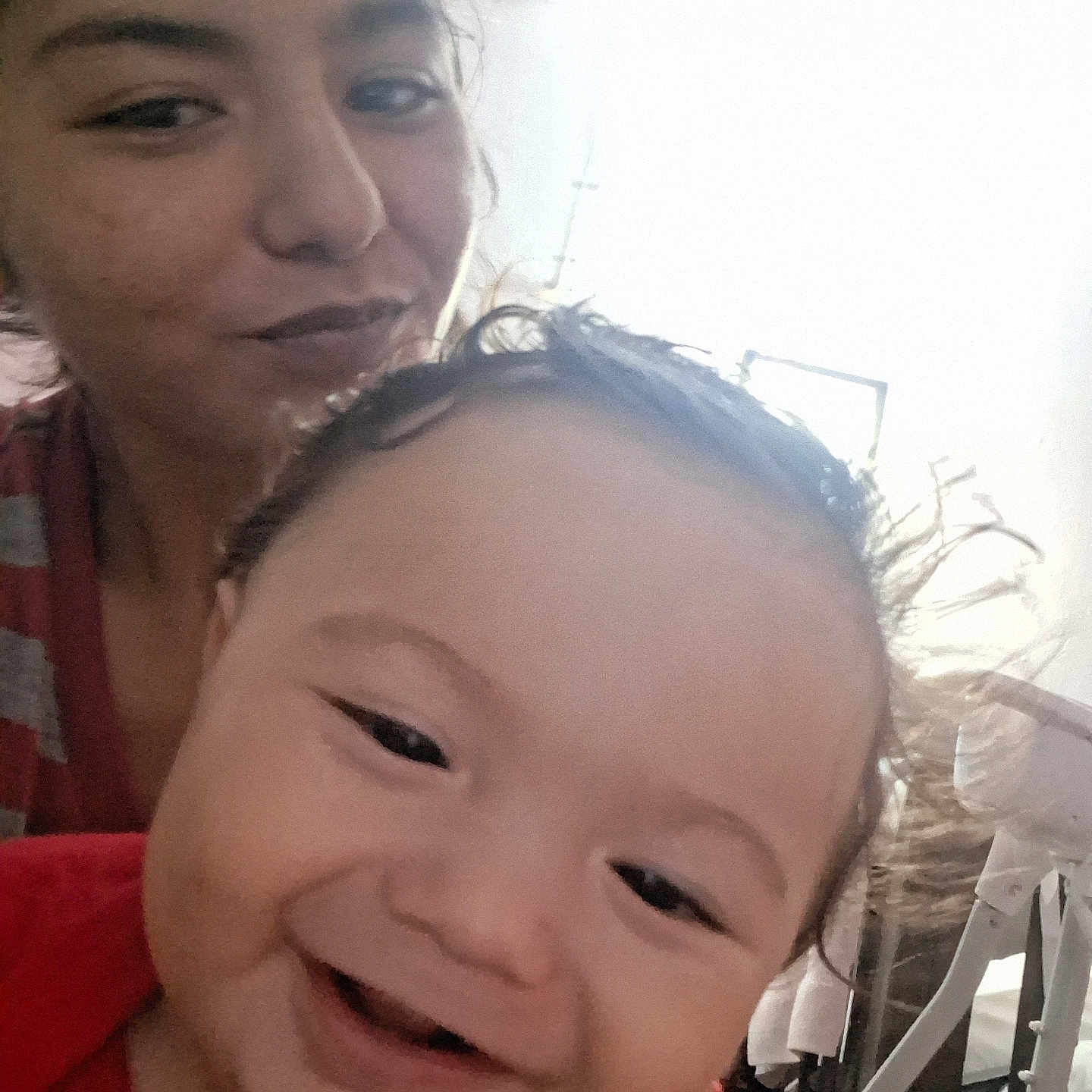 Benito is registered to the contest to win money with this photo: baby, background, candid, casual, child, closeup, expression, face, family, hair, happy, head, indoors, light, person, portrait, skin, smiling, woman, young