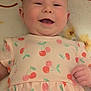 Elodie joined the competition — help win amazing prizes! apparel, baby, blanket, cherry, child, cute, dress, face, floral, hand, happy, indoors, infant, lying_down, one_person, pattern, person, skin, smiling, soft
