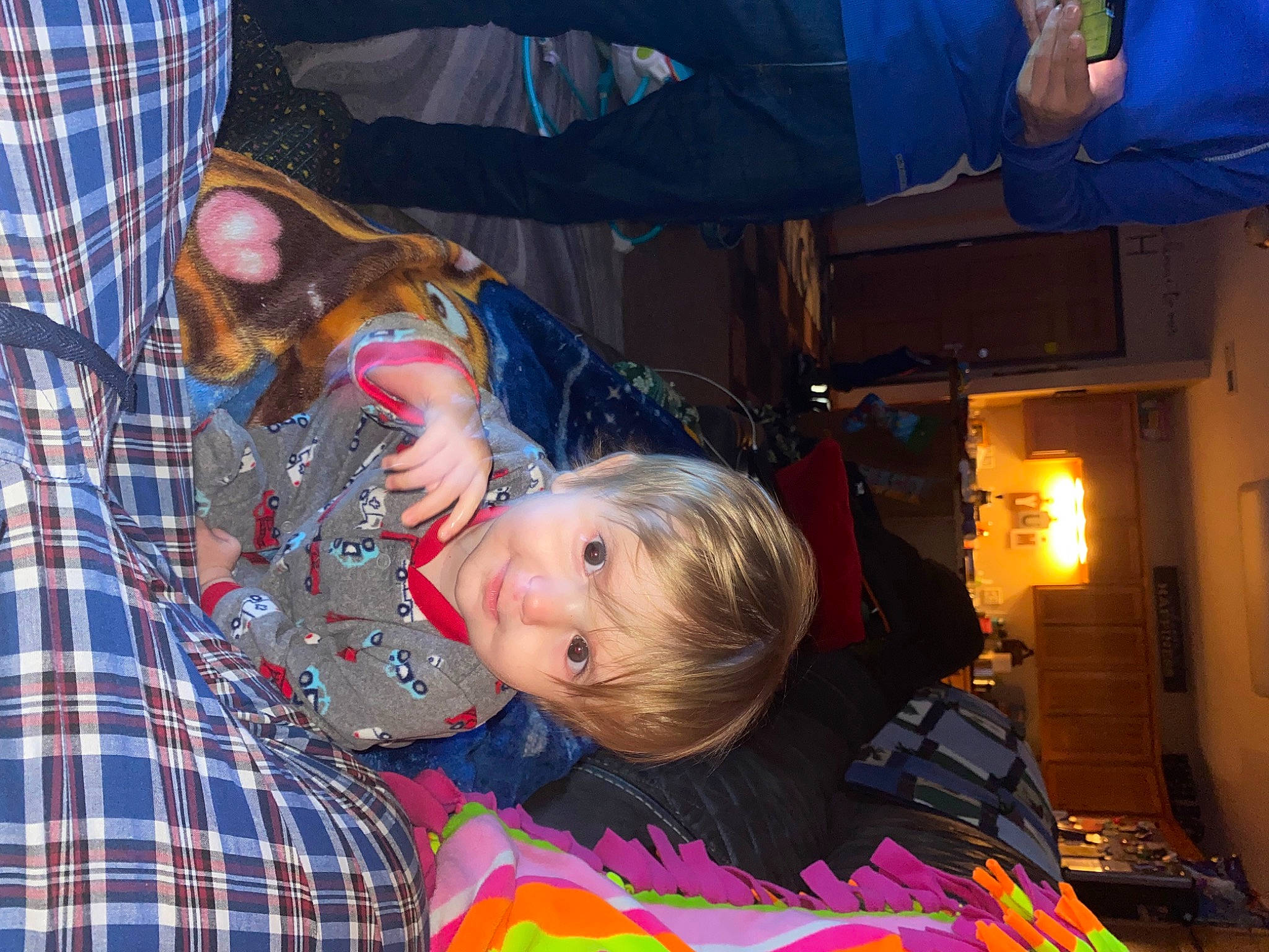 Owen is registered to the contest to win money with this photo: baby, blue, child, comfort, event, fun, happy, leisure, pattern, person, plaid, sitting, tartan, toddler, tree