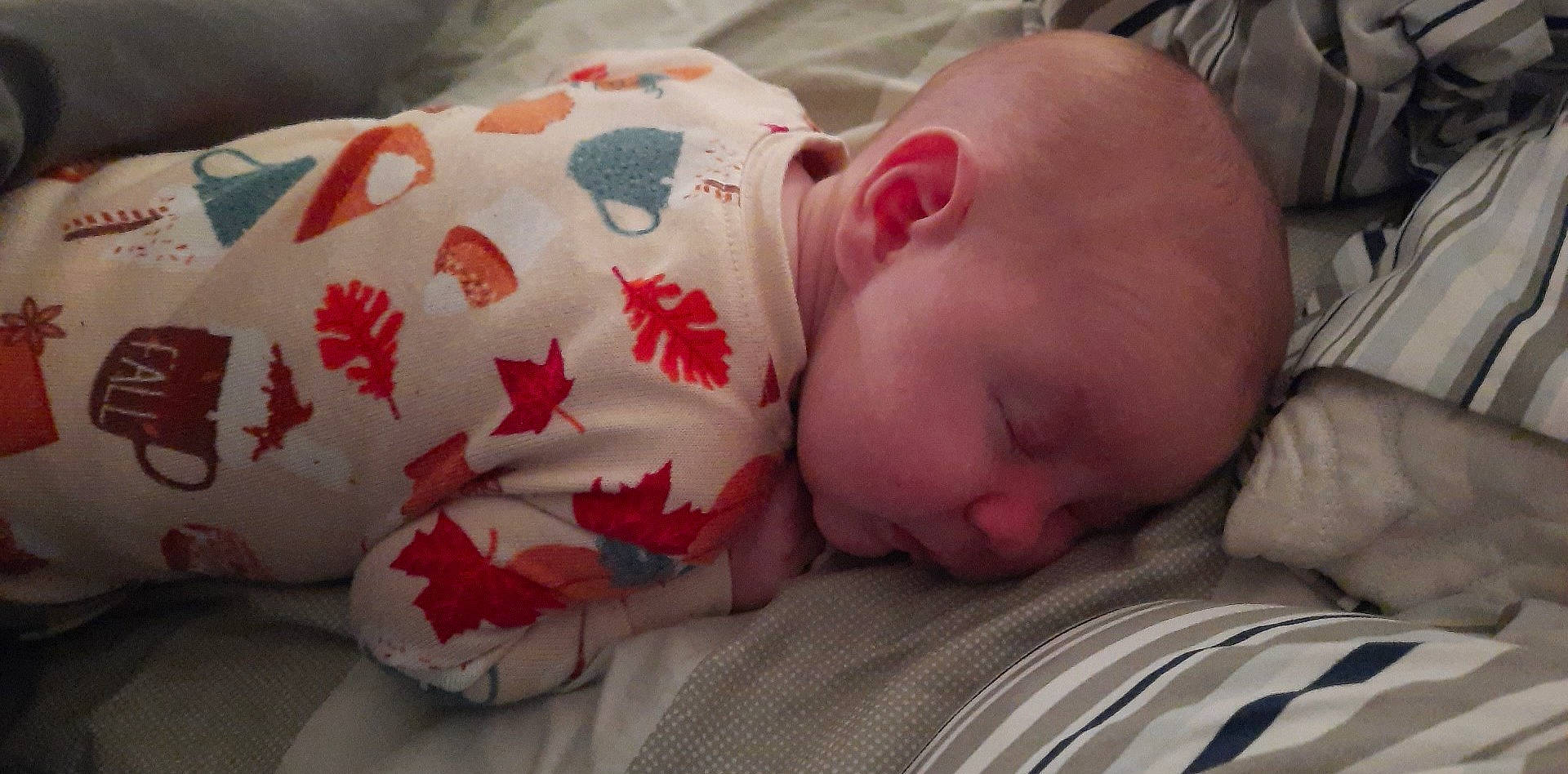 Mckinley is registered to the contest to win money with this photo: baby, baby_sleeping, baby_toddler_clothing, bedtime, carmine, cheek, child, comfort, event, flesh, linens, mammal, mouth, nap, person, room, skin, sleep, sleeve, textile