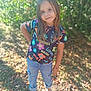 Kehlani is registered to the contest to win money with this photo: child, girl, outdoor, nature, sunlight, greenery, flowers, colorful_clothing, jeans, sneakers, standing, smiling, casual, playful_pose, daylight, leaves, grass, portrait, happy, young