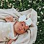baby, infant, bow, blanket, greenery, flowers, outdoor, nature, grass, cute, portrait, headband, lying_down, peaceful, soft_texture, child, summer, fresh, young, relaxed