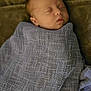baby, sleeping, blanket, wrapped, cozy, soft, resting, peaceful, infant, face, head, closed_eyes, newborn, child, indoors, portrait, comfort, warm, cuddly, quiet
