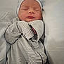 Braxton joined the competition — help win amazing prizes! baby, newborn, sleeping, pajamas, striped_clothing, cap, infant, bed, pillow, cozy, peaceful, person, child, resting, soft, blanket, cute, indoors, sleep, portrait