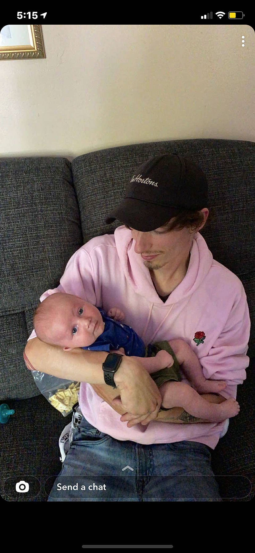 Cruz is registered to the contest to win money with this photo: abdomen, arm, baby, baby_products, baseball_cap, cap, child, comfort, couch, elbow, hat, headwear, jeans, knee, lap, person, room, sitting, sun_hat, t_shirt