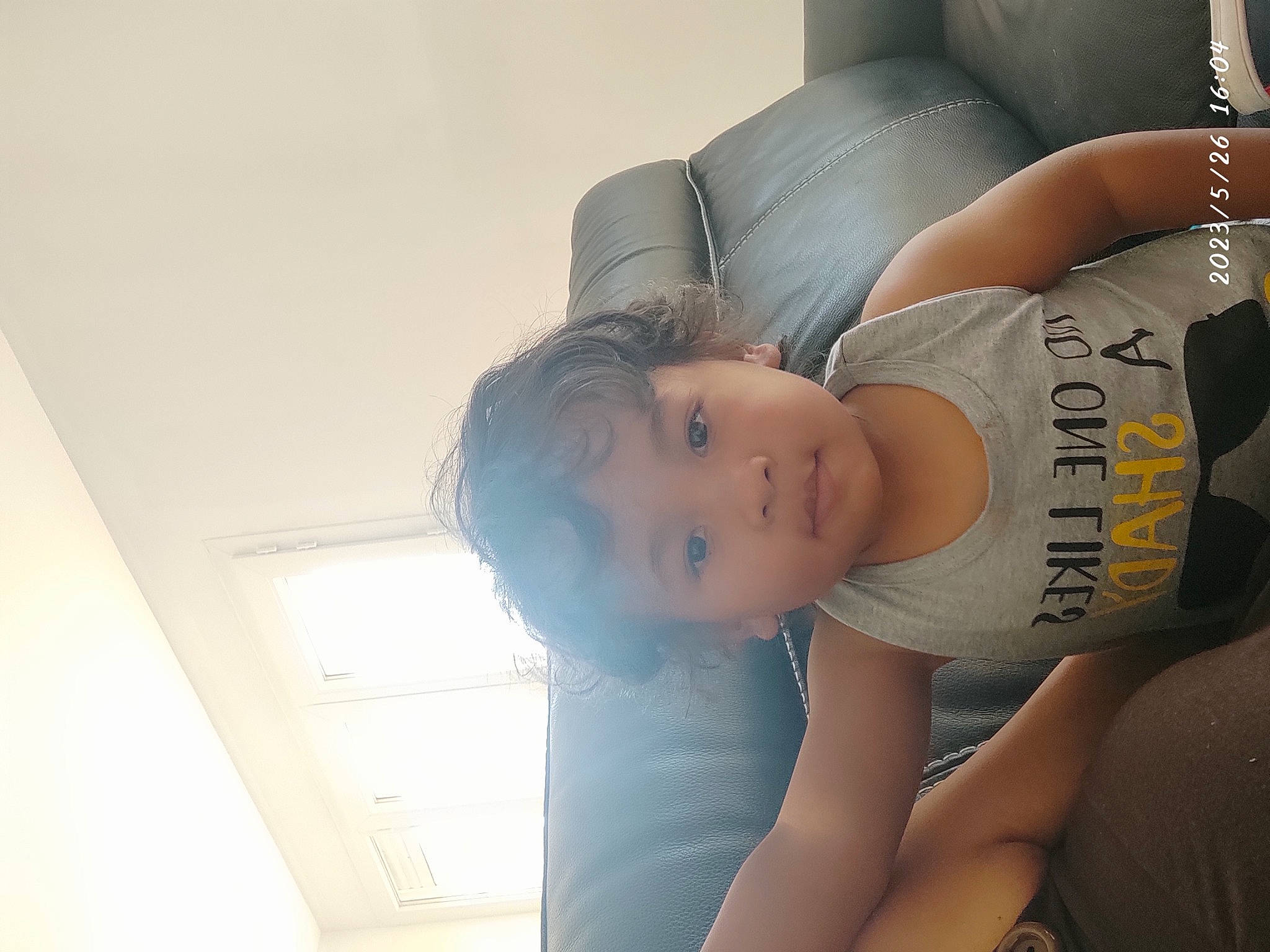 Nolan participe au concours pour gagner de l'argent avec cette photo : abdomen, arm, black_hair, chest, comfort, elbow, eyelash, flash_photography, hat, headgear, human_body, human_leg, knee, person, shoulder, sitting, sleeve, thigh, trunk, waist