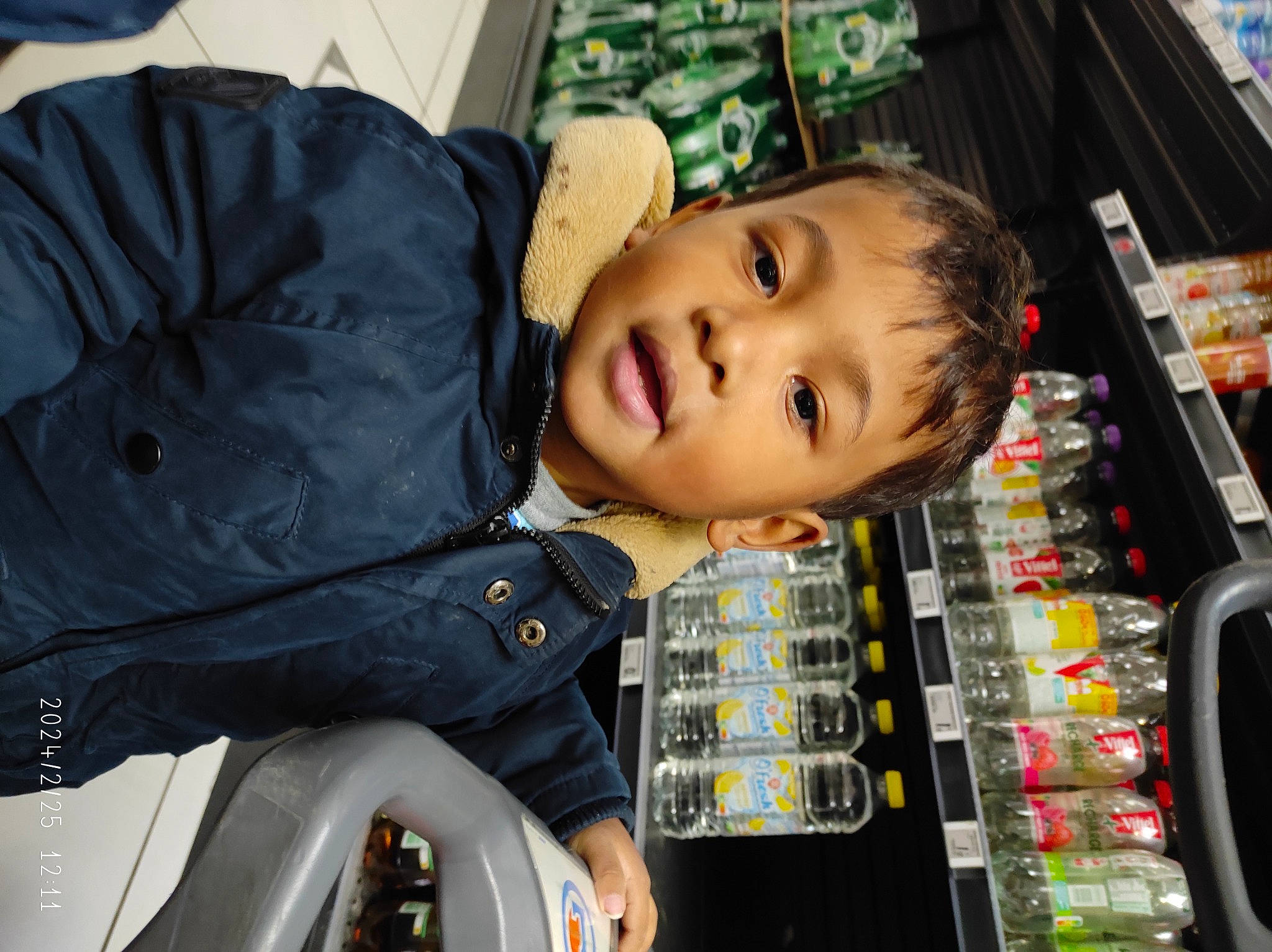 Nolan participe au concours pour gagner de l'argent avec cette photo : baby, baby_toddler_clothing, child, comfort, fun, jacket, kitchen_appliance, machine, person, product, room, smile, toddler