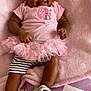 baby, smiling, pink, headband, tutu, blanket, cute, infant, dimples, clothing, footwear, striped_shorts, happy, lying_down, soft_texture, indoors, child, person, portrait, fashion