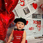 Taeo is registered to the contest to win money with this photo: baby, balloons, beret, child, clothing, cute, decor, expression, graffiti, heart, indoor, love, newspaper, person, photography, portrait, red, sitting, valentines_day, xoxo