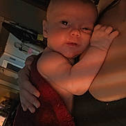 Kamiyah joined the competition — help win amazing prizes! baby, child, person, towel, skin, arm, hand, face, indoor, dim_light, holding, cuddle, comfort, warm, intimate, sleepy, resting, human, parent, closeup