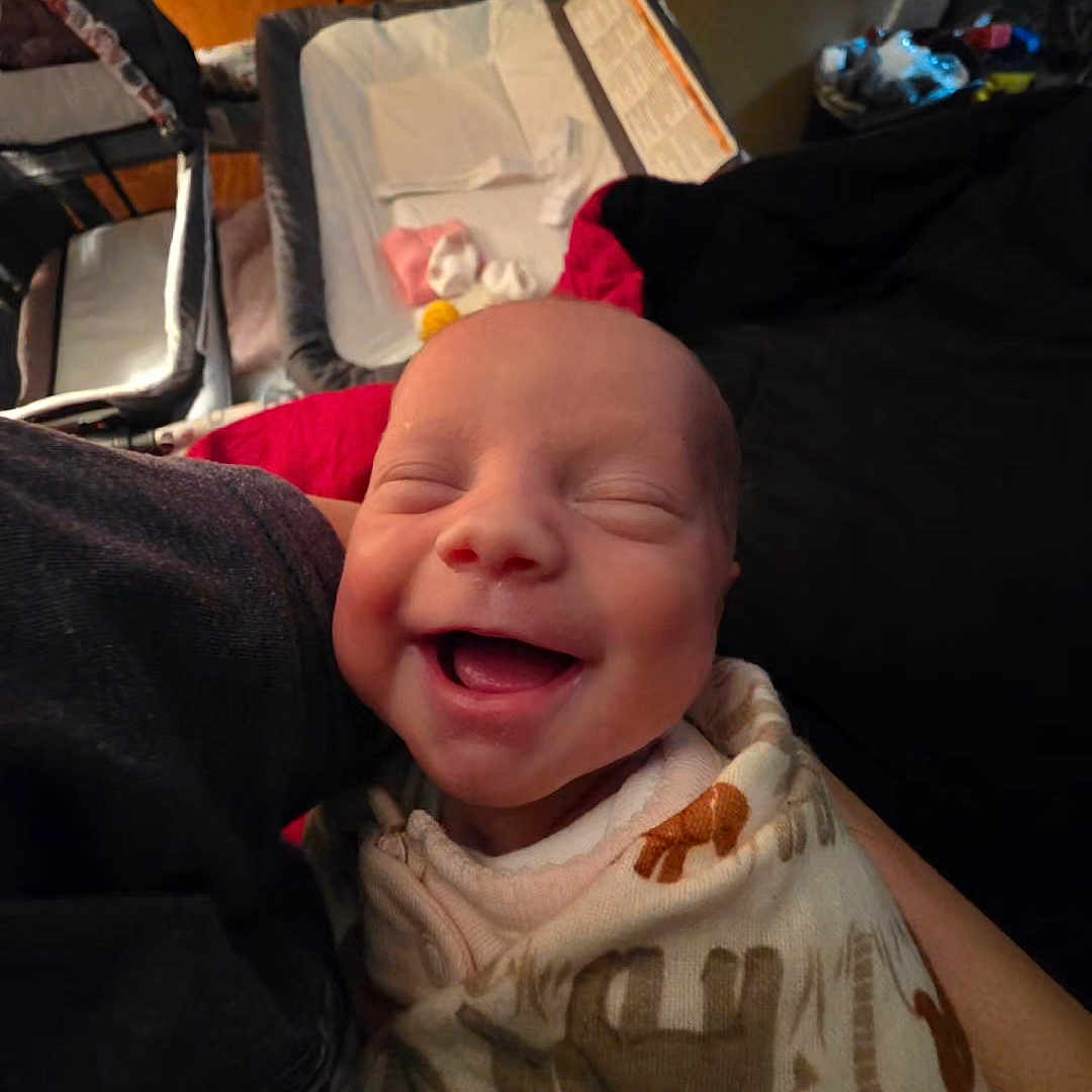 Kamiyah joined the competition — help win amazing prizes! newborn, baby, smiling, wrapped, blanket, animal_print, infant, cozy, nursery, bassinet, baby_essentials, happy, face, human, child, indoor, soft_lighting, portrait, cute, sleepy