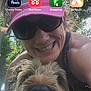 Rascal is registered to the contest to win money with this photo: woman, dog, smile, sunglasses, visor, outdoor, trees, happy, pet, portrait, closeup, face, canine, nature, sunlight, fur, nose, head, casual, fun