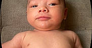 Jaxson joined the competition — help win amazing prizes! baby, infant, bare_chest, face, skin, expression, lying_down, soft_texture, curious, young_child, head, chubby_cheeks, indoors, portrait, close_up, newborn, person, human, baby_boy, calm
