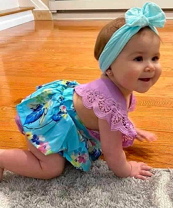 Maliya Jo joined the competition — help win amazing prizes! baby_toddler_clothing, barefoot, blue, cap, child, costume_hat, flooring, foot, fun, happy, headgear, headpiece, headwear, human_leg, magenta, person, pink, sleeve, smile, thigh