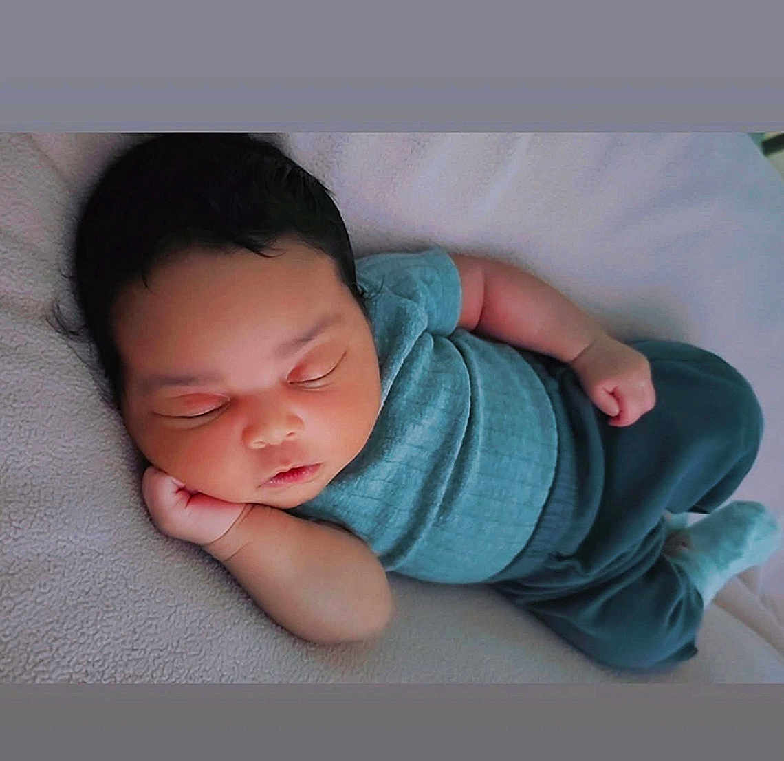 Rhonnie Stokes joined the competition — help win amazing prizes! baby, sleeping, infant, child, blanket, soft, cozy, clothing, teal, pajamas, cute, peaceful, rest, nap, skin, face, hand, lying_down, indoors, portrait