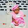 baby, toddler, child, pink_dress, beret, cushion, floor, tile_floor, indoor, portrait, black_and_white_background, letter_e, fashion, cute, sitting, person, clothing, footwear, studio_photography, expression