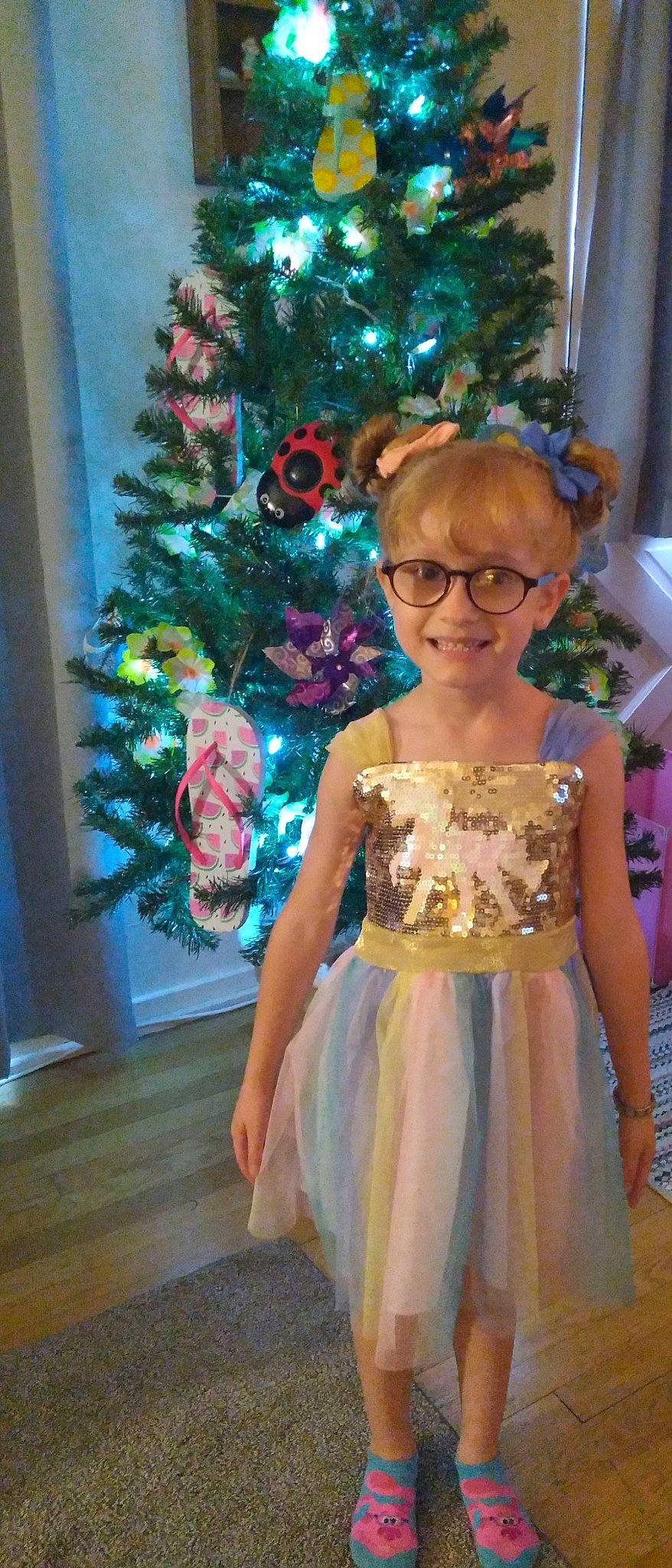 Nevaeh is registered to the contest to win money with this photo: christmas_decoration, christmas_ornament, christmas_tree, day_dress, dress, electric_blue, event, eyewear, fashion_design, formal_wear, fun, glasses, gown, happy, holiday_ornament, joy, magenta, one_piece_garment, ornament, person