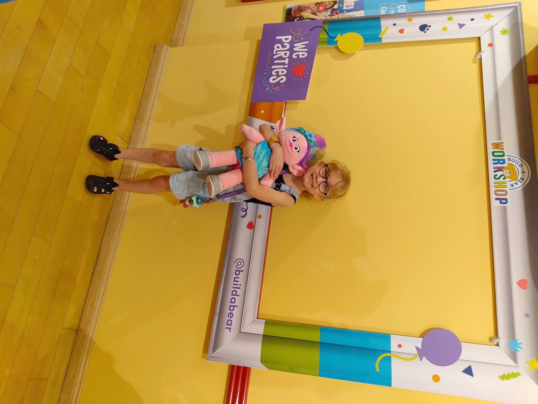 Nevaeh is registered to the contest to win money with this photo: child, flooring, fun, games, hardwood, joy, ladder, leisure, office_supplies, paper_product, person, play, recreation, room, shelf, smile, toddler, toy, visual_arts, walking_shoe