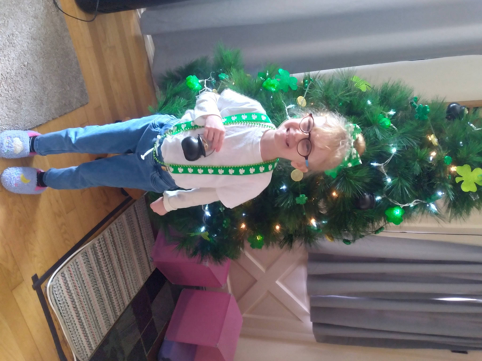 Nevaeh is registered to the contest to win money with this photo: christmas, christmas_decoration, christmas_eve, christmas_ornament, christmas_tree, costume, event, flooring, fun, green, hardwood, holiday, holiday_ornament, joy, lap, ornament, person, plant, room, thigh